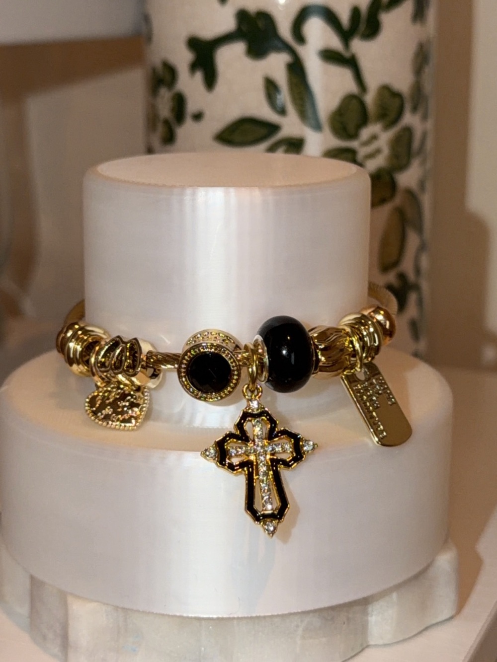 Gold Tone Women's Charm Bracelet with Black Accents and Cross Pendant